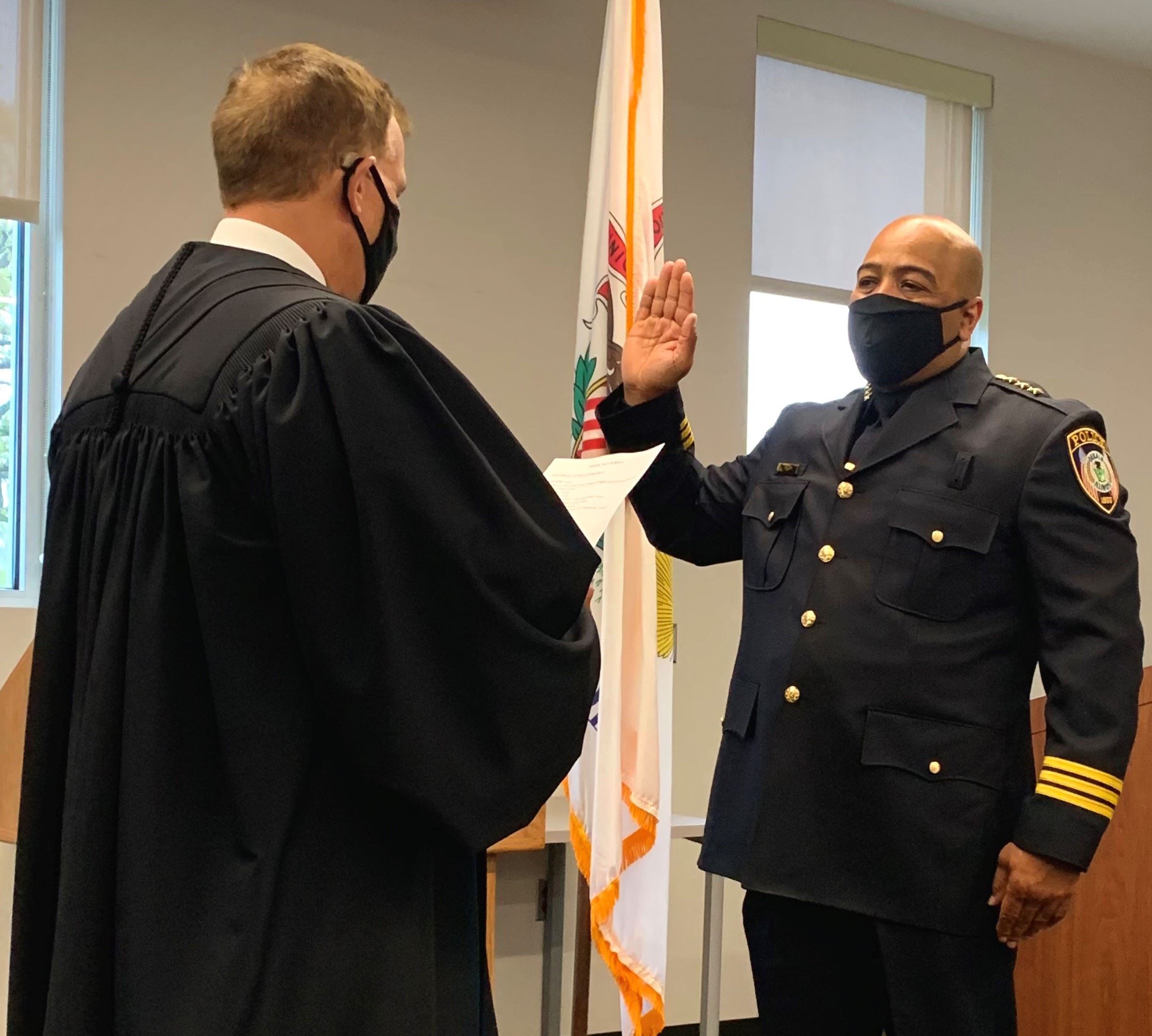 DeKalb Police Chief David Byrd is sworn in by Judge Ron Matekaitis