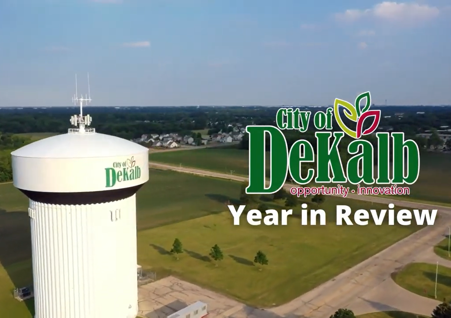 The Dresser Road water tower, the City logo and text reading 