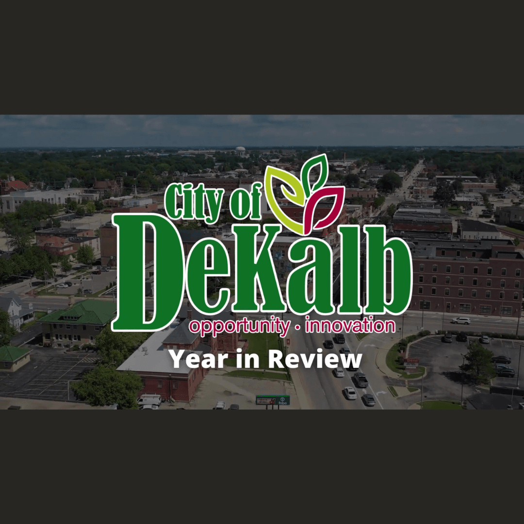 An aerial photo of downtown DeKalb with the City logo and the text 