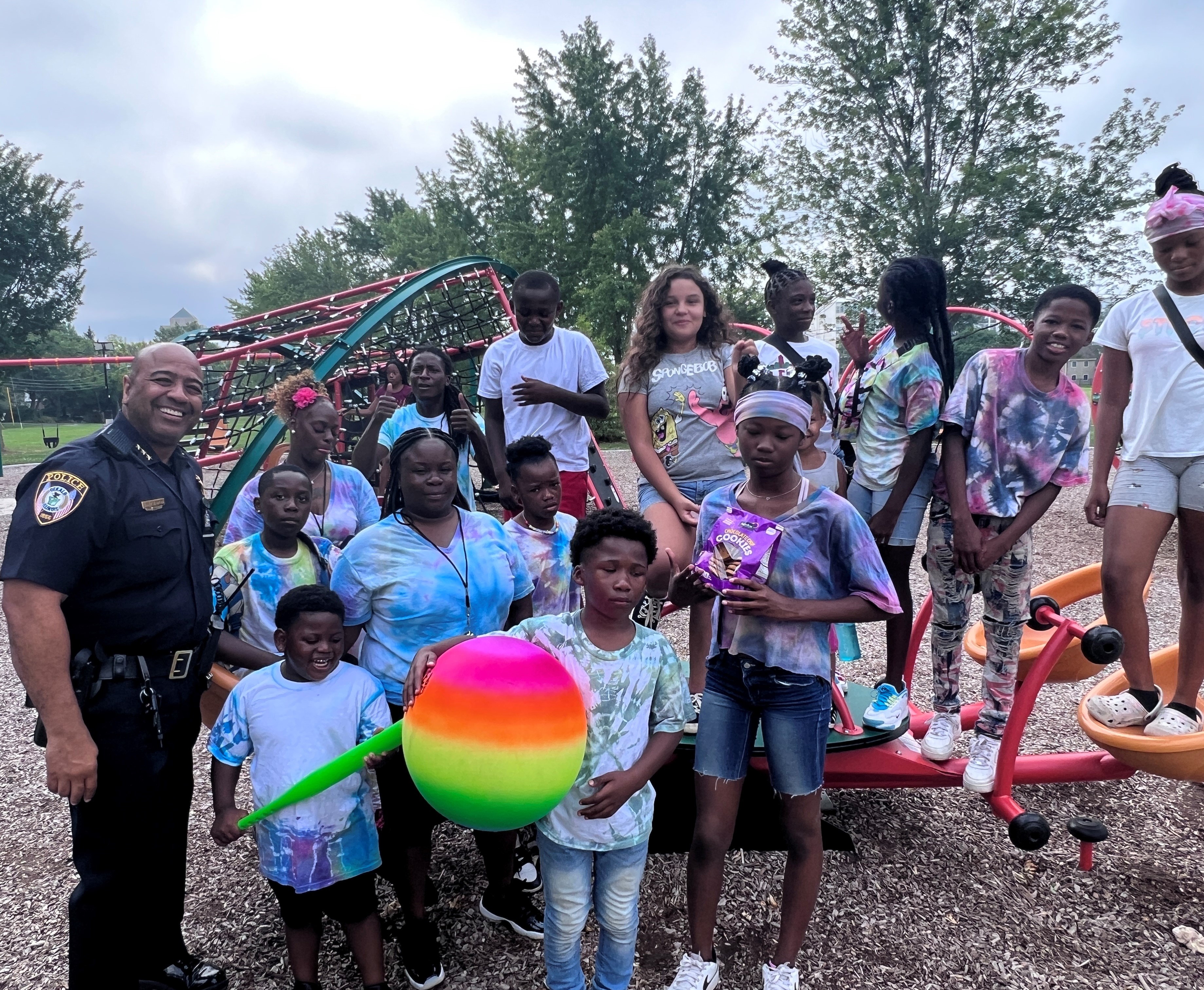 DeKalb Police Chief David Byrd gathers with children in Welsh Park