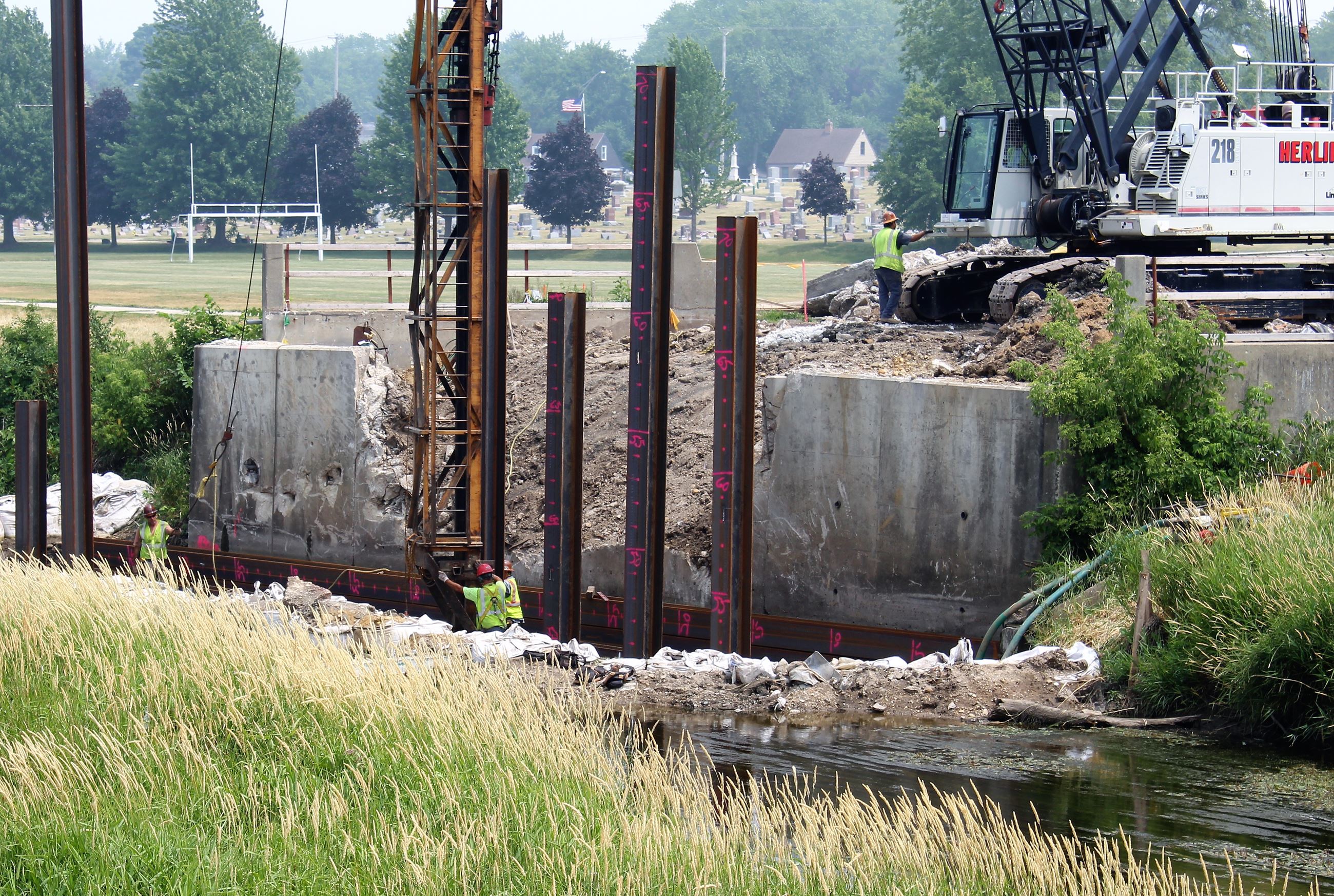 A construction crew continues work on the North First St. bridge replacement.