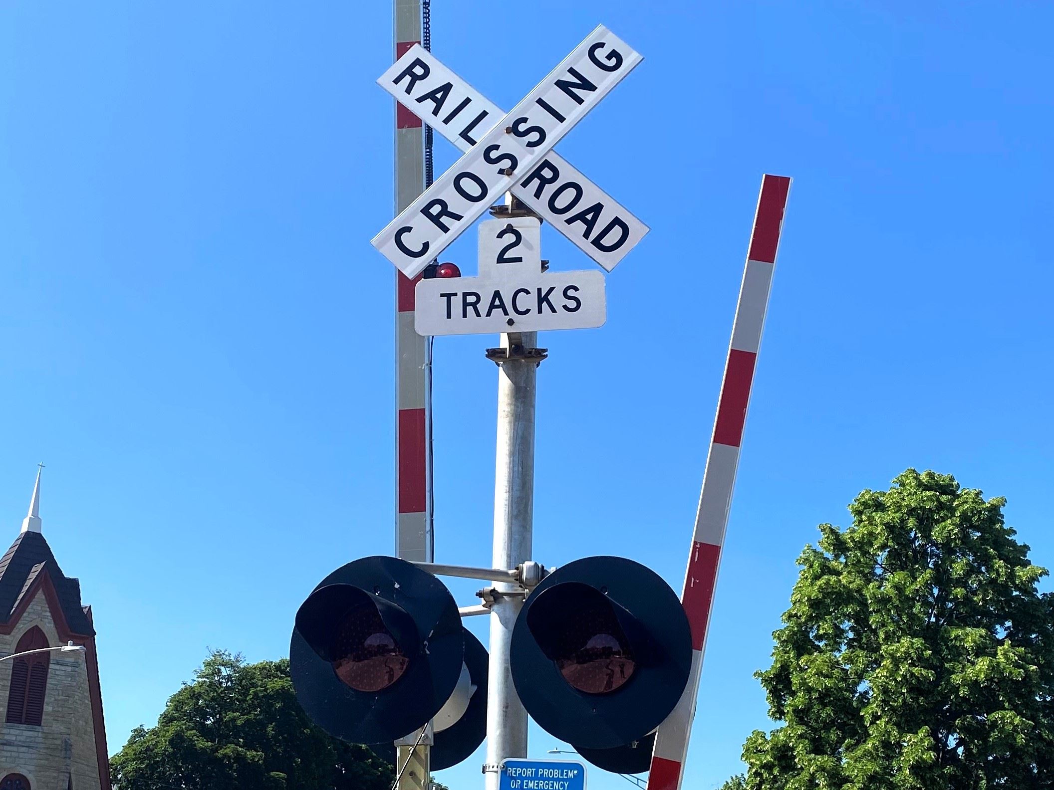 A railroad crossing sign and signal at the South Second Street crossing.