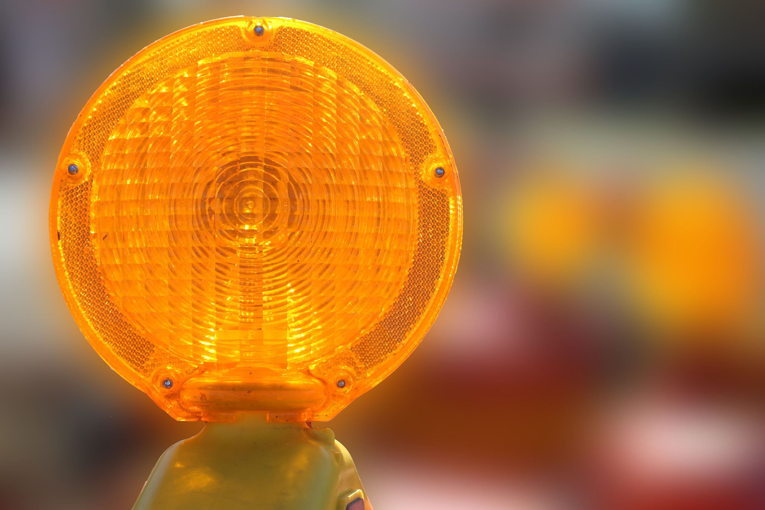 The orange light of a construction horse