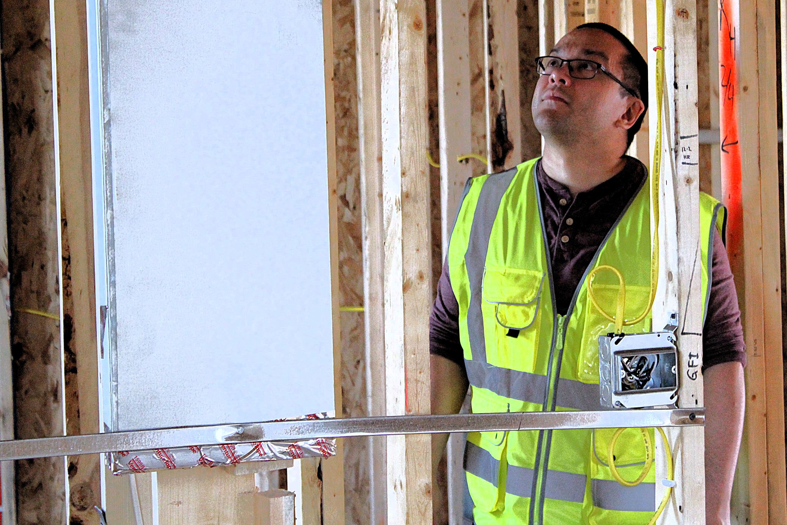 A Building & Code Division team member inspects a home under construction.