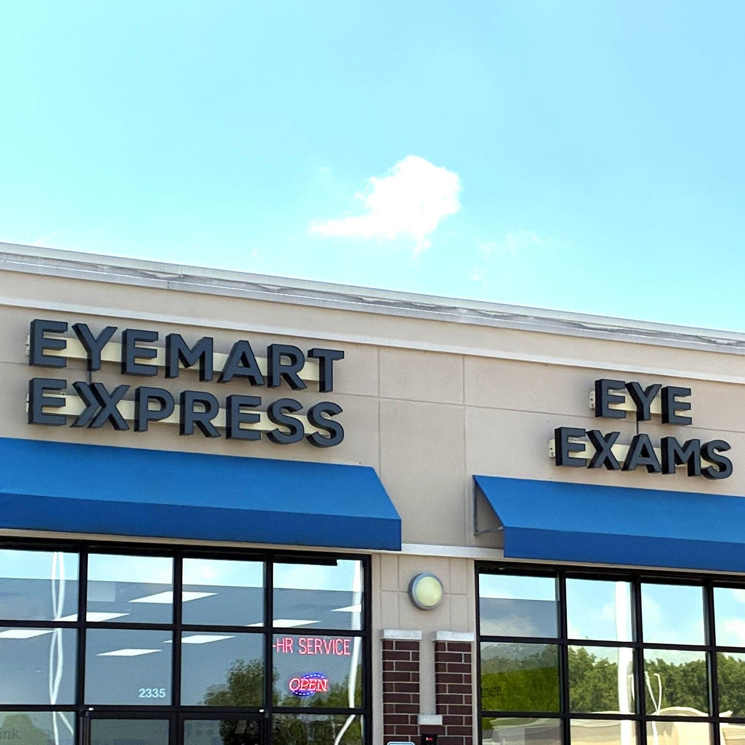The storefront and signs for Eyemart Express