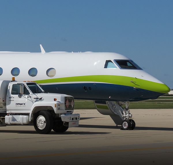 Airplane and Service Vehicle on Runway