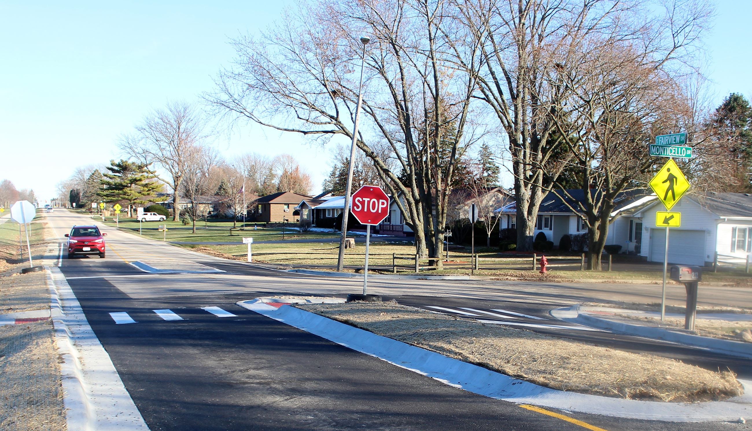 A car stops at the new traffic calming islands on Fairview Drive at Monticello Drive.