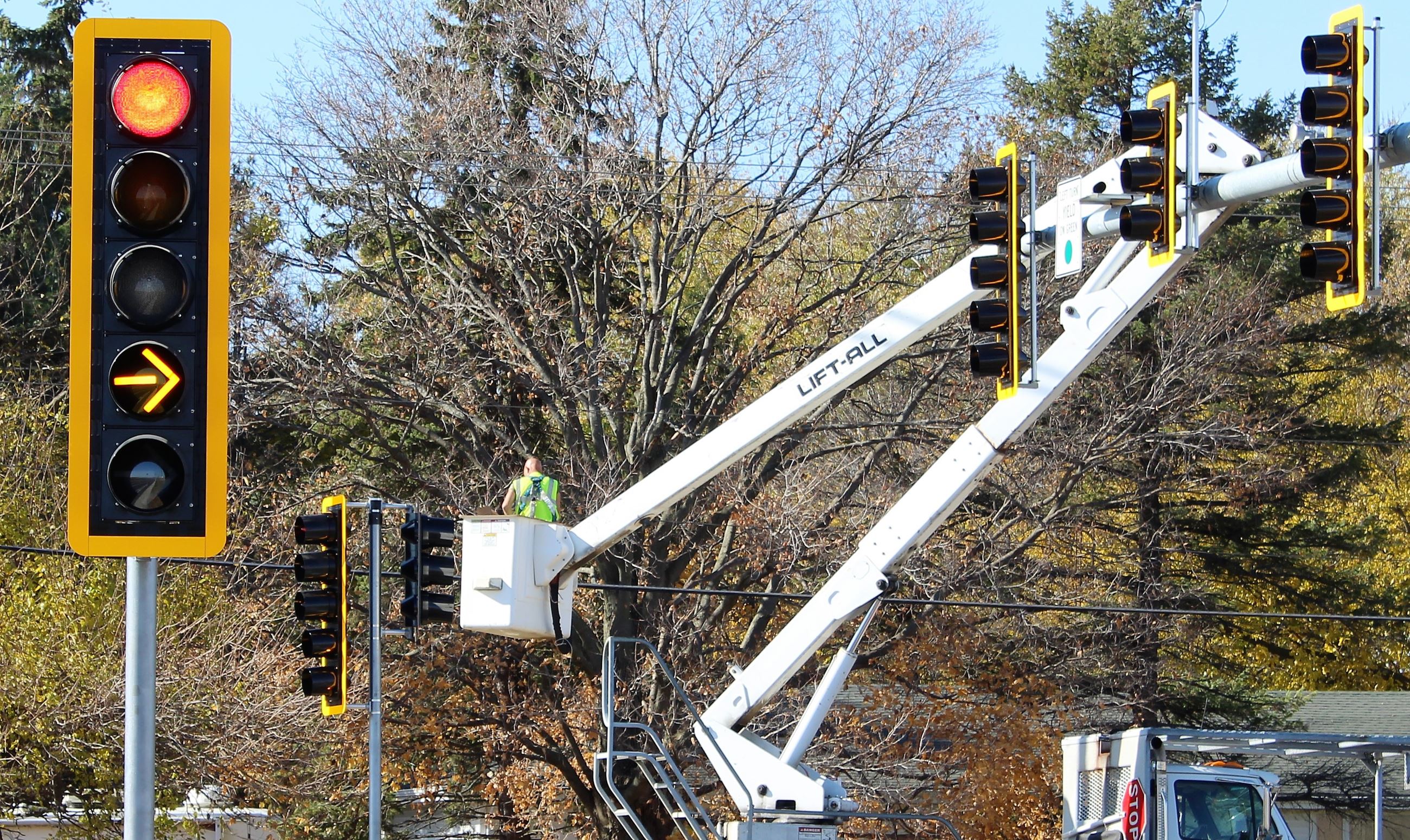 A worker activates the traffic signals at Route 23 and Gurler Road.