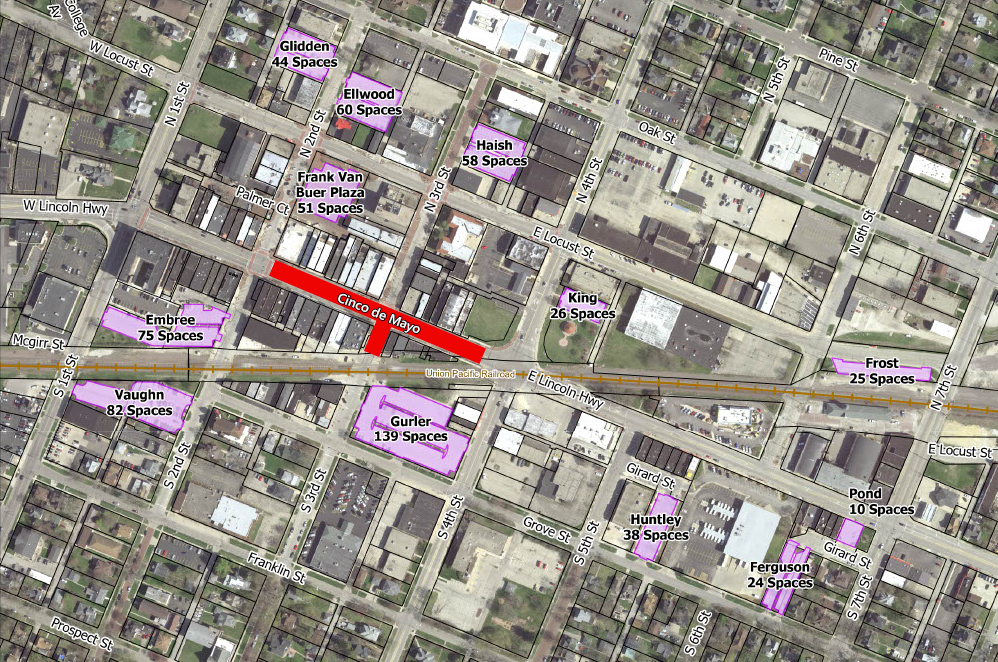 A map of downtown DeKalb shows the location of the Cinco de Mayo event and public parking lots.